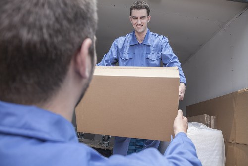 Office moving team preparing desks and equipment in Bermondsey