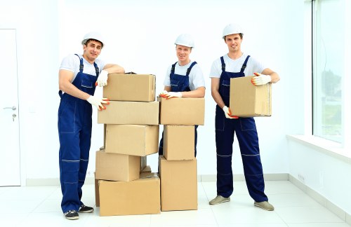 Removal team planning a house move in Bermondsey with packed boxes and furniture