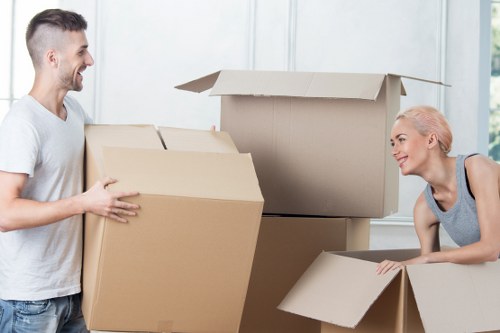 Careful wrapping and lifting preparation for a piano move in a Bermondsey property