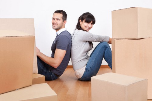 Commercial moving team preparing furniture for transport